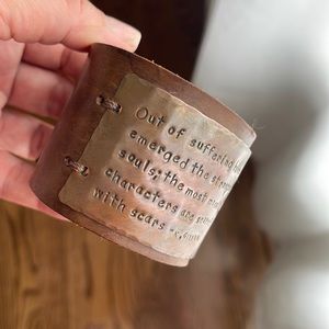 Leather cuff.